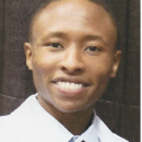 A headshot of a smiling person wearing a white shirt and striped tie.